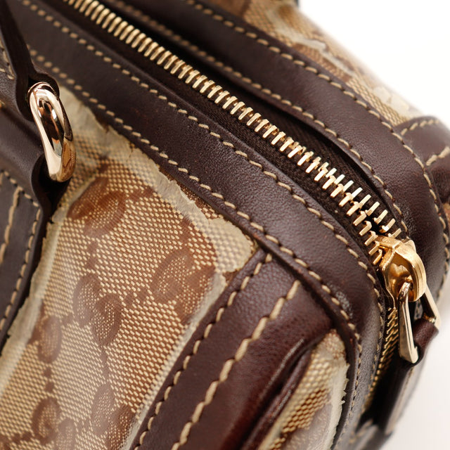 Détail fermeture zippée dorée sac Gucci Boston occasion authentique — AMANA Vintage