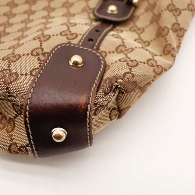 Détail des anses tressées Gucci Tote Pelham cuir marron foncé occasion authentique — AMANA Vintage
