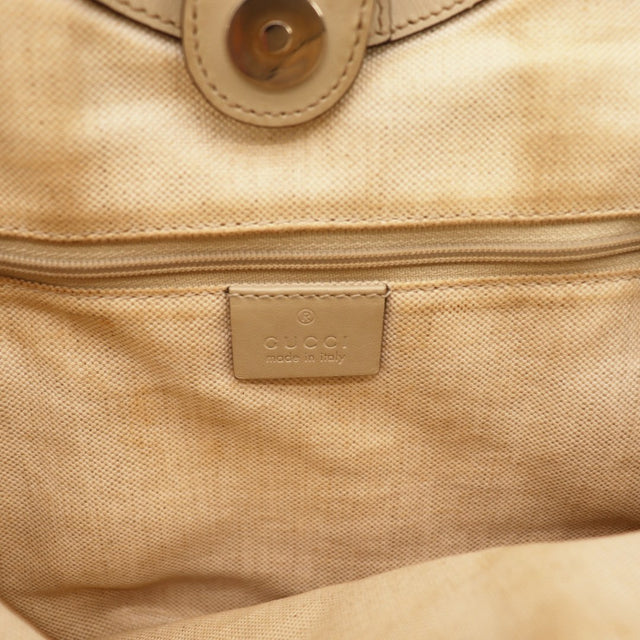 Détail de la toile Gucci Tote toile monogrammée beige et ébène occasion authentique — AMANA Vintage
