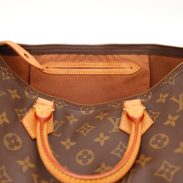 Détail des anses Louis Vuitton Speedy 35 Toile Monogramme occasion authentique — AMANA Vintage