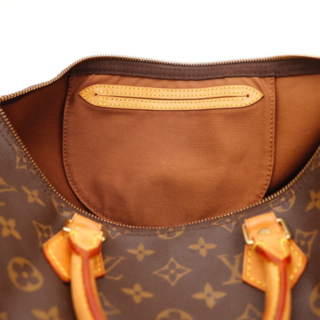 Détail cadenas doré Louis Vuitton Speedy 35 occasion authentique — AMANA Vintage
