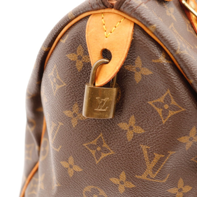 Détail des pattes latérales Louis Vuitton Speedy 35 Toile Monogramme occasion authentique — AMANA Vintage