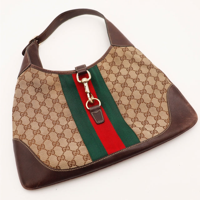 Détail du bas de sac Gucci New Jackie cuir marron patiné occasion authentique — AMANA Vintage