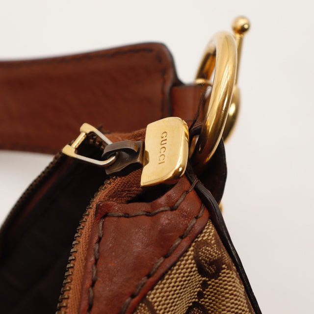 Détail des coins Gucci Hobo Jockey cuir marron cognac occasion authentique — AMANA Vintage