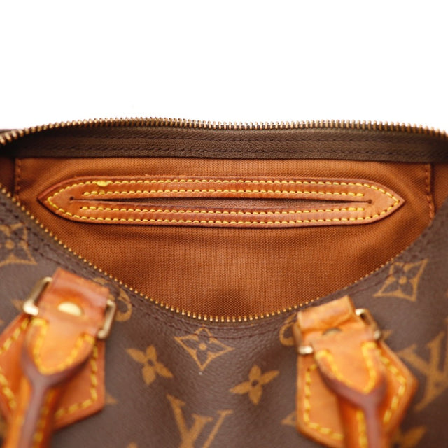 Détail des anses Louis Vuitton Speedy 25 Toile Monogramme occasion authentique — AMANA Vintage