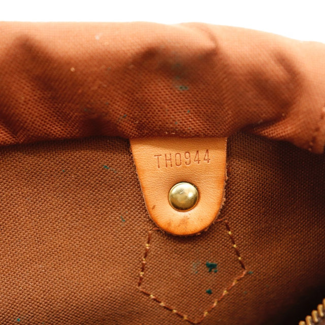 Détail des anses Louis Vuitton Speedy 25 cuir vachette caramel occasion authentique — AMANA Vintage