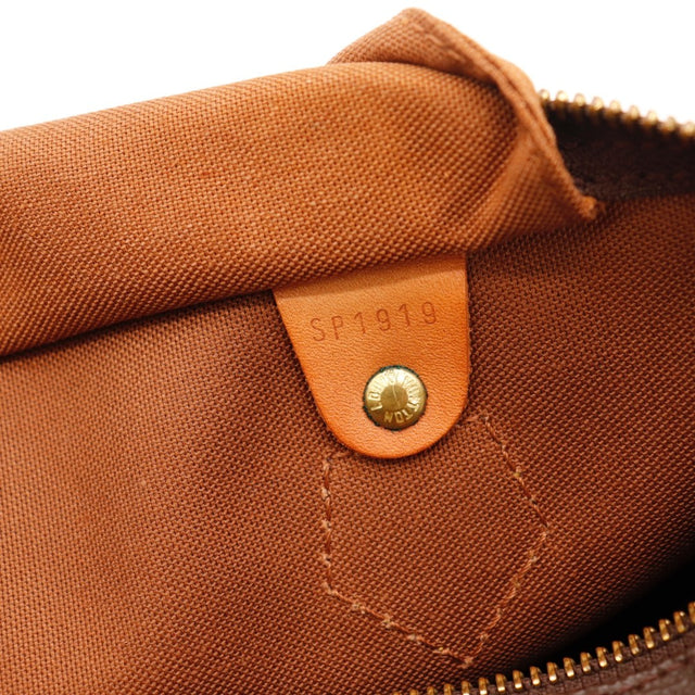 Détail de la patine Louis Vuitton Speedy 30 cuir vachette caramel occasion authentique — AMANA Vintage