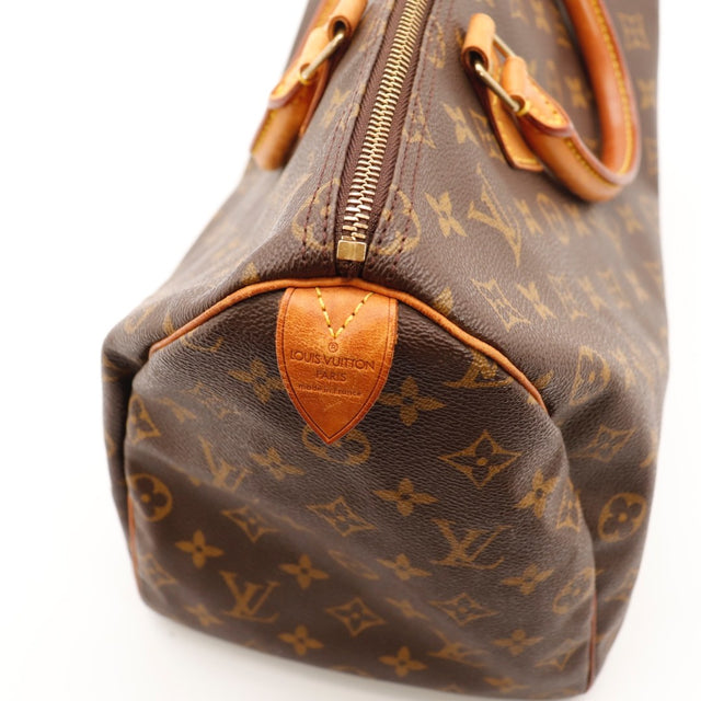 Détail du cadenas Louis Vuitton Speedy 35 Toile Monogramme occasion authentique — AMANA Vintage