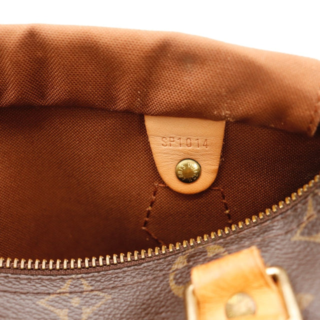 Détail des attaches d'anses Louis Vuitton Speedy 25 Toile Monogramme occasion authentique — AMANA Vintage