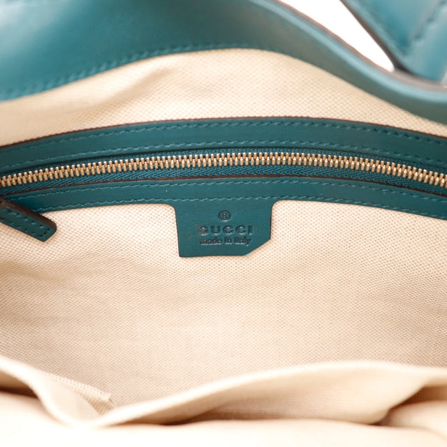 Vue de profil Gucci New Jackie cuir lisse bleu canard occasion authentique — AMANA Vintage