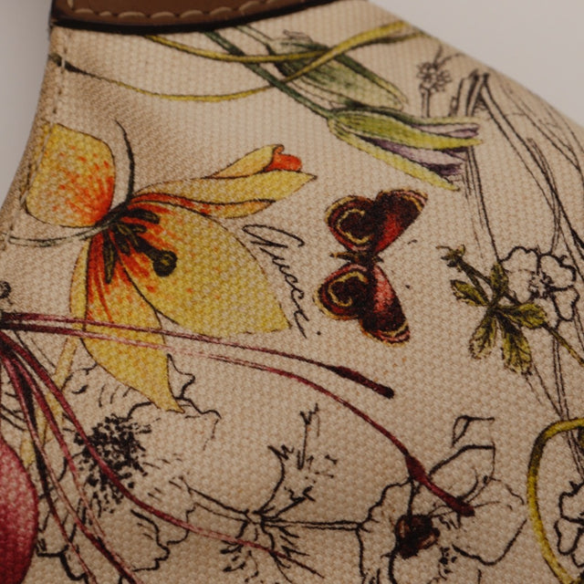 Détail des bordures en cuir Gucci Jackie toile Flora — AMANA Vintage