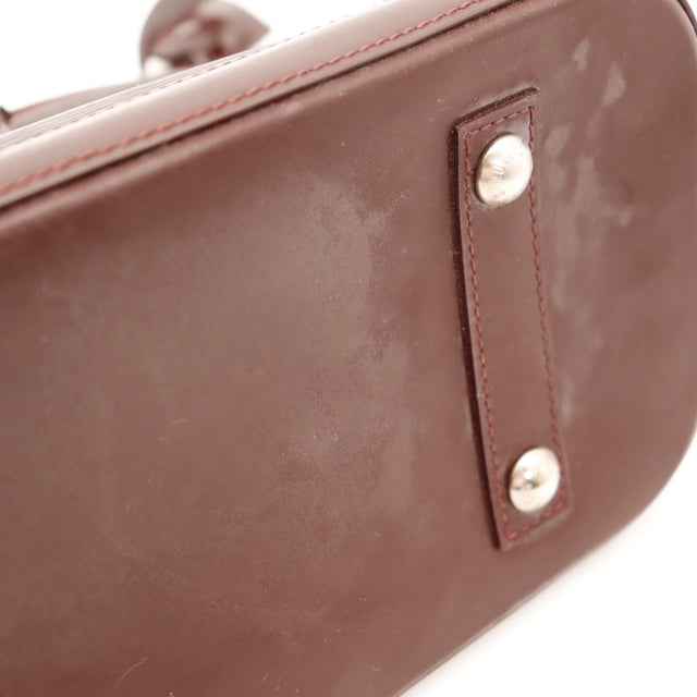 Vue de la base Louis Vuitton Alma PM cuir Épi bordeaux occasion authentique — AMANA Vintage