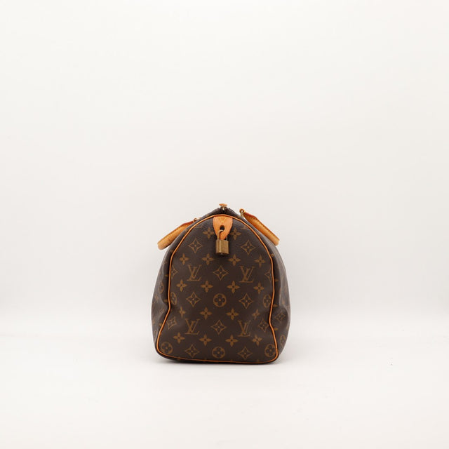 zijaanzicht Louis Vuitton Speedy 35 met hangslot in lipje in vachettaleer — AMANA Vintage
