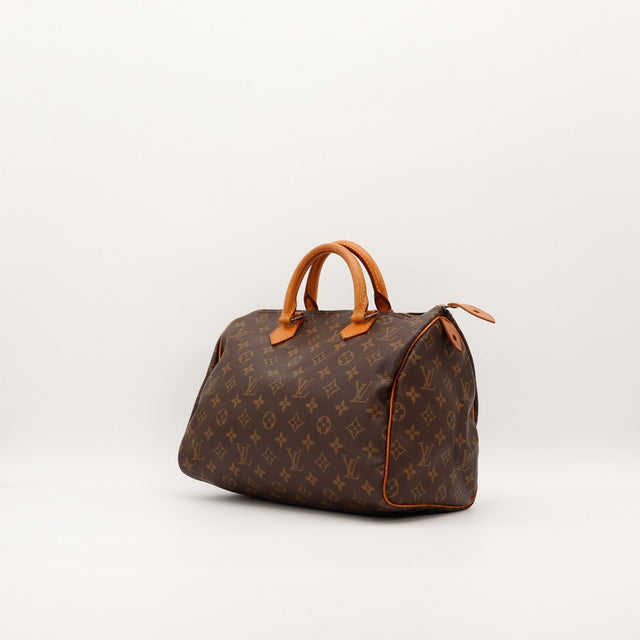 Louis Vuitton Speedy 30 vue de trois quarts toile Monogram patine caramel — AMANA Vintage