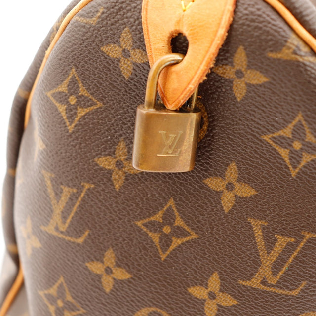 hangslot Louis Vuitton goudkleurig met patina Speedy 35 tweedehands — AMANA Vintage
