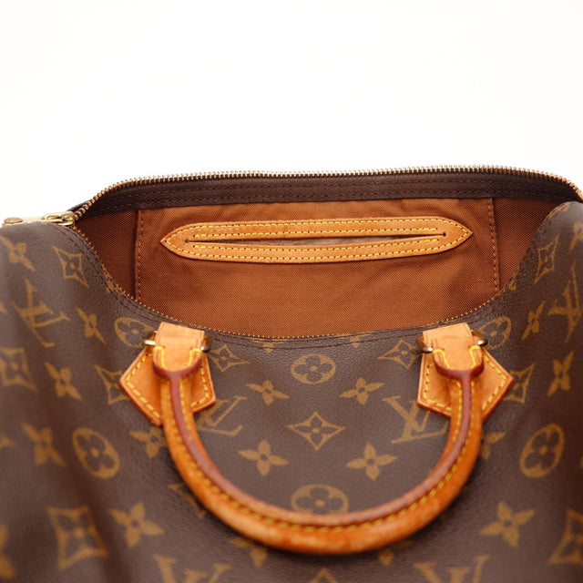 Binnenkant Louis Vuitton Speedy 30 voering bruin en poche vachettaleer — AMANA Vintage