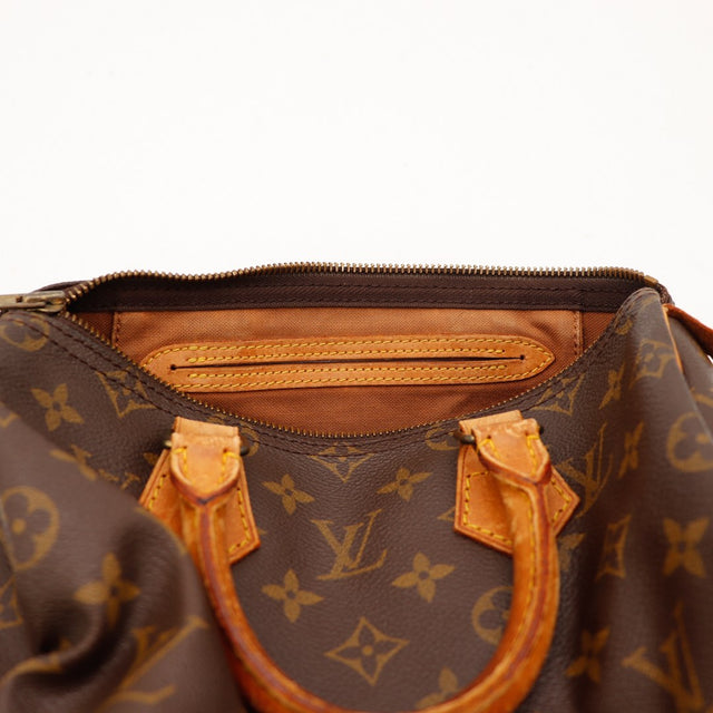 Binnenkant Louis Vuitton Speedy 25 voering bruin ritsvak — AMANA Vintage
