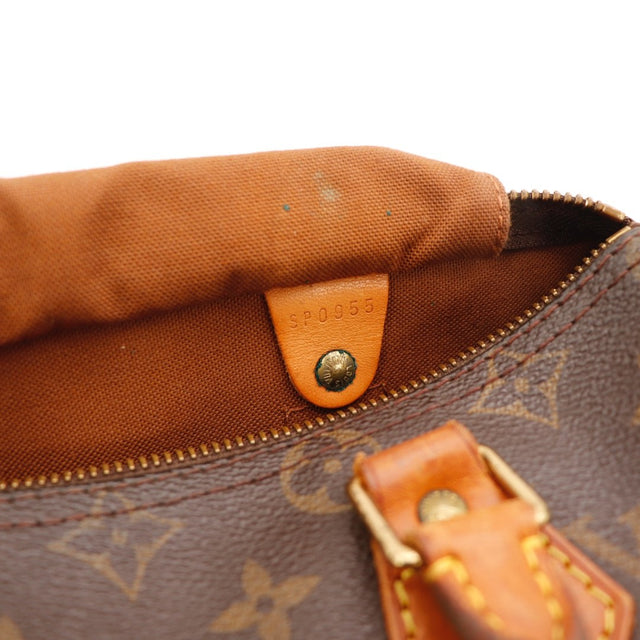 Détail du curseur de fermeture Louis Vuitton Speedy 25 Toile Monogramme occasion authentique — AMANA Vintage