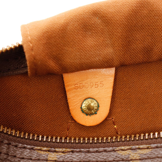Detail lipje hangslot Louis Vuitton Speedy 30 vachette usée — AMANA Vintage