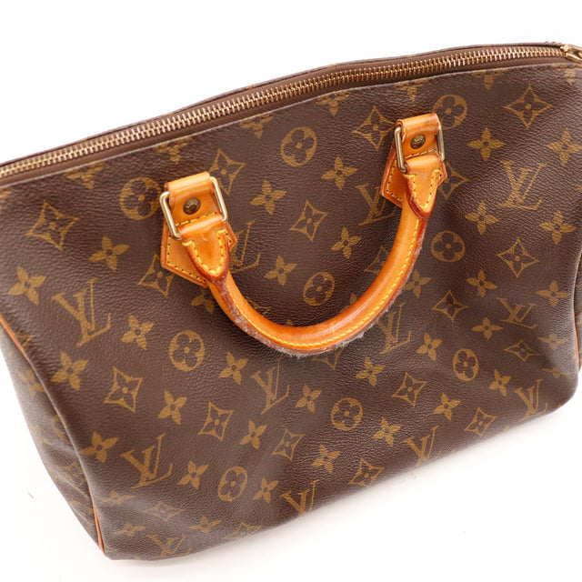 Vue rapprochée Monogram-canvas Louis Vuitton Speedy 30 handvat vachette — AMANA Vintage