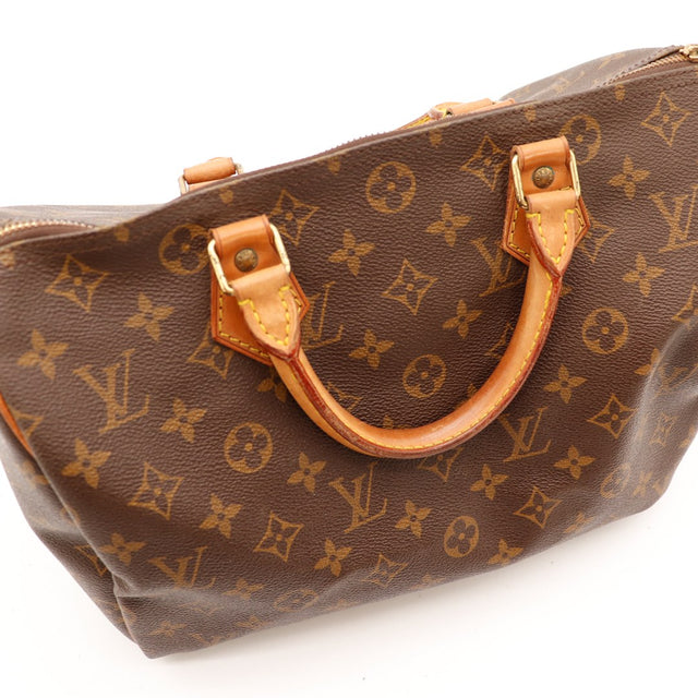 Detail handvatten patine caramel bevestigingen vachette Louis Vuitton Speedy 30 — AMANA Vintage