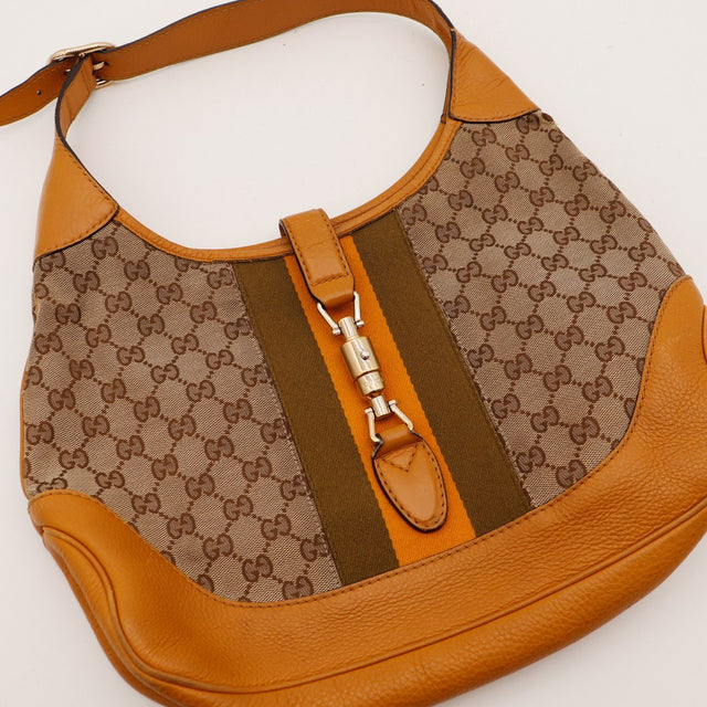 Détail fermoir Jackie piston Gucci bande Web kaki orange — AMANA Vintage