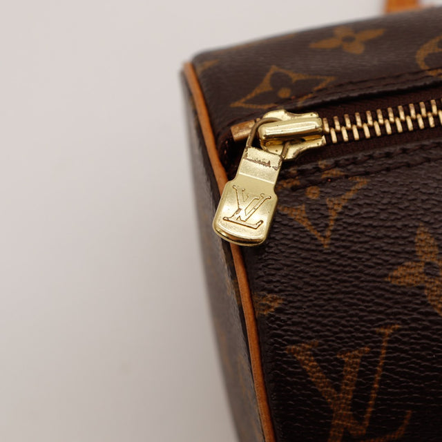 Détail tirette zip Louis Vuitton Papillon 30 curseur doré LV — AMANA Vintage