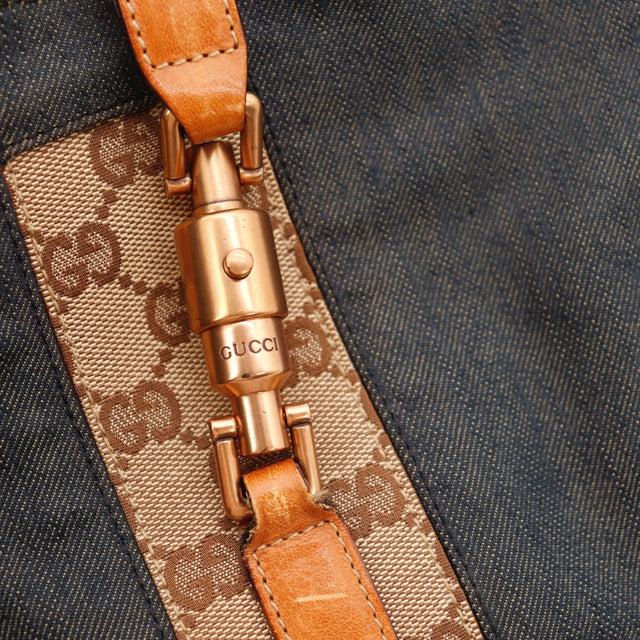 Vue de côté Gucci Jackie denim bleu occasion authentique — AMANA Vintage