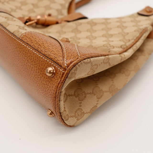 Détail attache anse Gucci New Jackie cuir grené et argenterie dorée vintage — AMANA Vintage