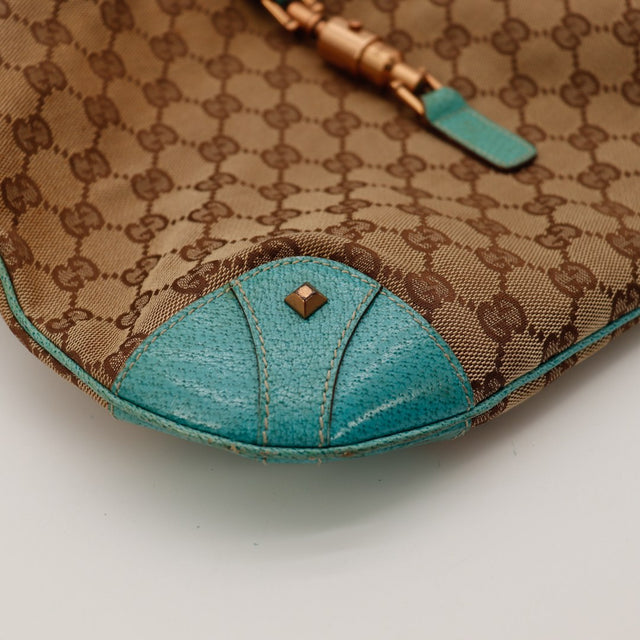 Détail coin inférieur Gucci New Jackie cuir turquoise occasion — AMANA Vintage