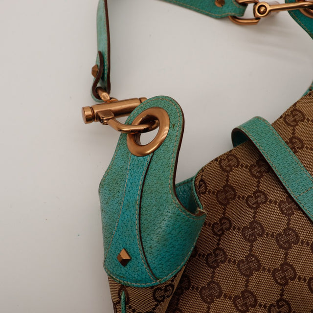 Détail attache anse Gucci New Jackie cuir turquoise dorure bronze — AMANA Vintage