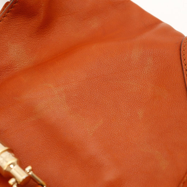 Détail surface cuir cognac Gucci New Jackie traces d'usage occasion authentique — AMANA Vintage