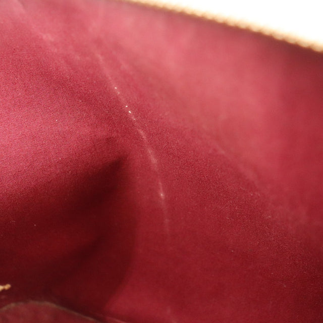 Détail doublure intérieure Louis Vuitton Alma PM Vernis Amarante — AMANA Vintage