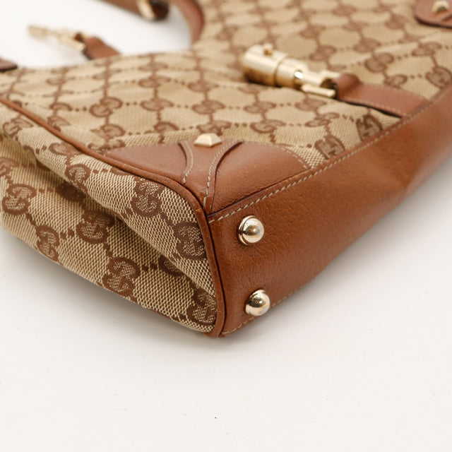 Détail coin inférieur Gucci New Jackie légers frottements cuir marron — AMANA Vintage