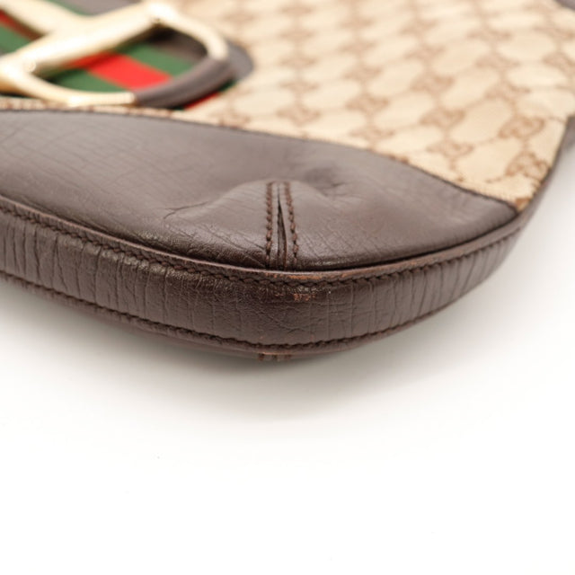 Détail bord inférieur cuir marron Gucci Hobo Horsebit occasion — AMANA Vintage