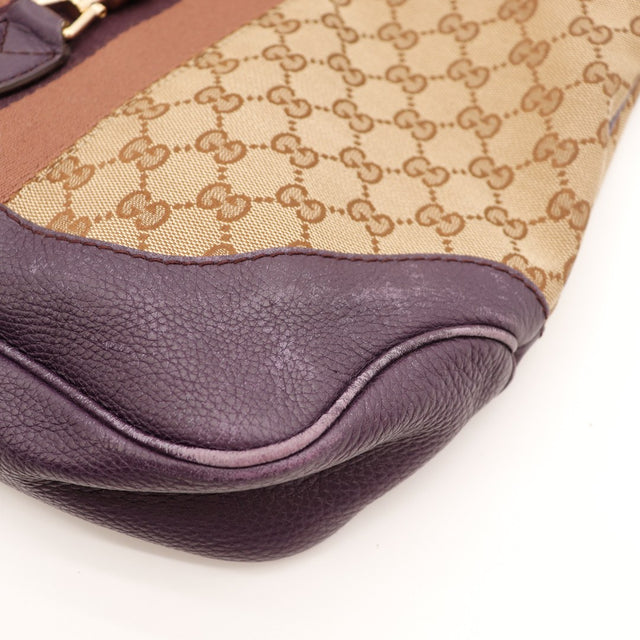 Détail anse cuir grené prune sac Gucci New Jackie décoloré — AMANA Vintage