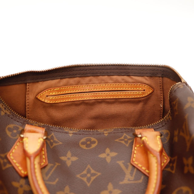 Détail de la tirette Louis Vuitton Speedy 30 Toile Monogramme occasion authentique — AMANA Vintage