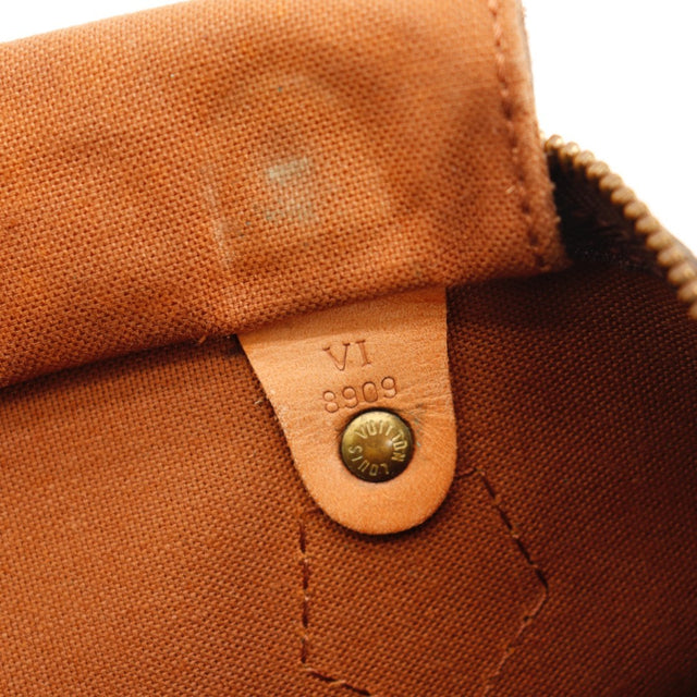Détail des anses Louis Vuitton Speedy 30 cuir vachette caramel occasion authentique — AMANA Vintage