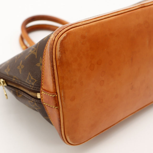 Detail fermeture eclair Louis Vuitton Alma PM dorure occasion — AMANA Vintage