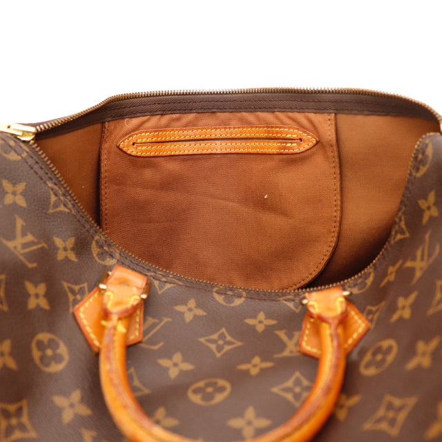 detail van ritstrekker van leer van Louis Vuitton Speedy 35 — AMANA Vintage