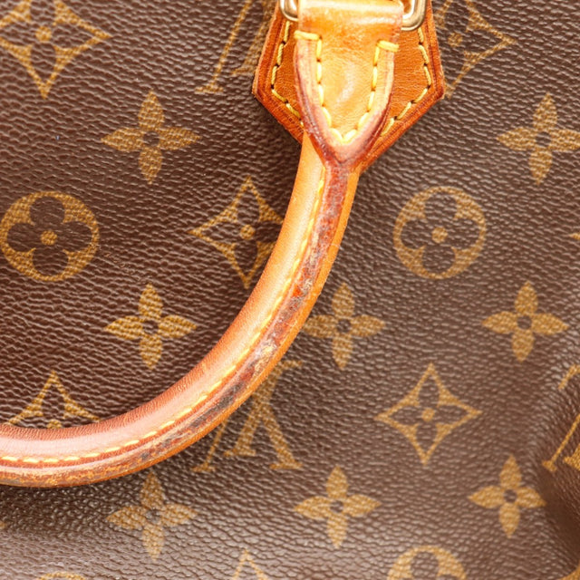 detail van het beslag goudkleurig van Louis Vuitton Speedy 35 — AMANA Vintage