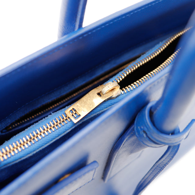 Détail fermeture éclair dorée intérieur Sac de Jour Saint Laurent bleu occasion — AMANA Vintage