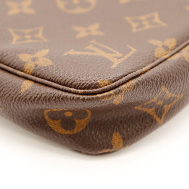 Vue de côté Louis Vuitton Pochette Accessoires Toile Monogramme marron occasion authentique — AMANA Vintage