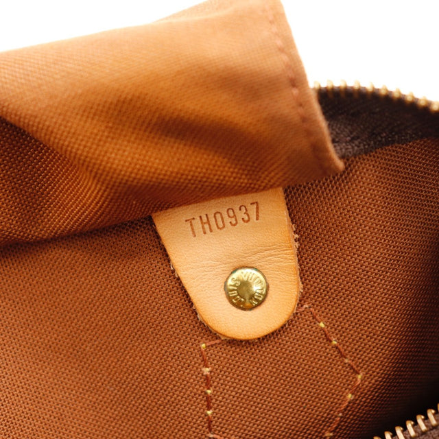 Détail d'un coin inférieur Louis Vuitton Speedy 30 Toile Monogramme occasion authentique — AMANA Vintage