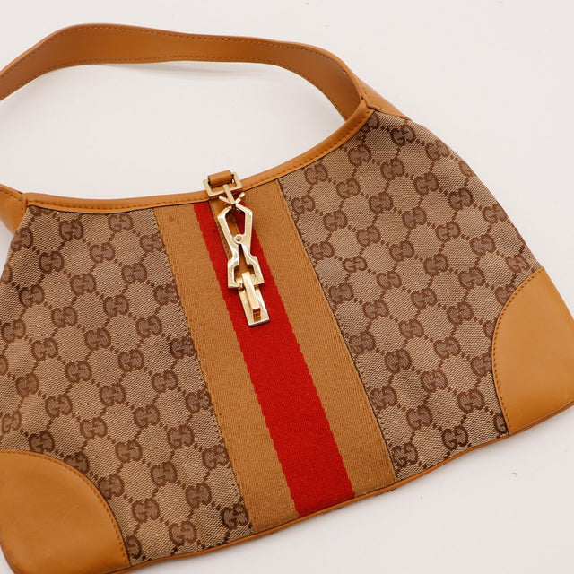 Détail piston Gucci Jackie bande rouge et beige occasion authentique — AMANA Vintage