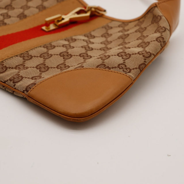 Détail coin inférieur Gucci Jackie cuir caramel occasion authentique — AMANA Vintage