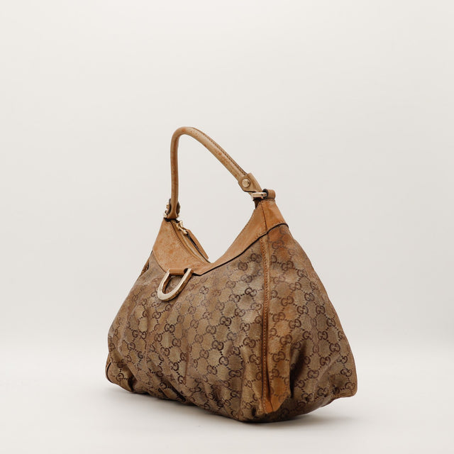 Sac Gucci Hobo vue de trois quarts toile monogrammée beige occasion authentique — AMANA Vintage