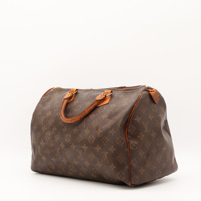 Détail de la tirette Louis Vuitton Speedy 35 cuir vachette occasion authentique — AMANA Vintage