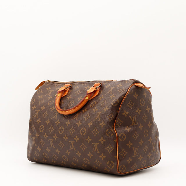 Détail de la tirette Louis Vuitton Speedy 35 cuir vachette occasion authentique — AMANA Vintage
