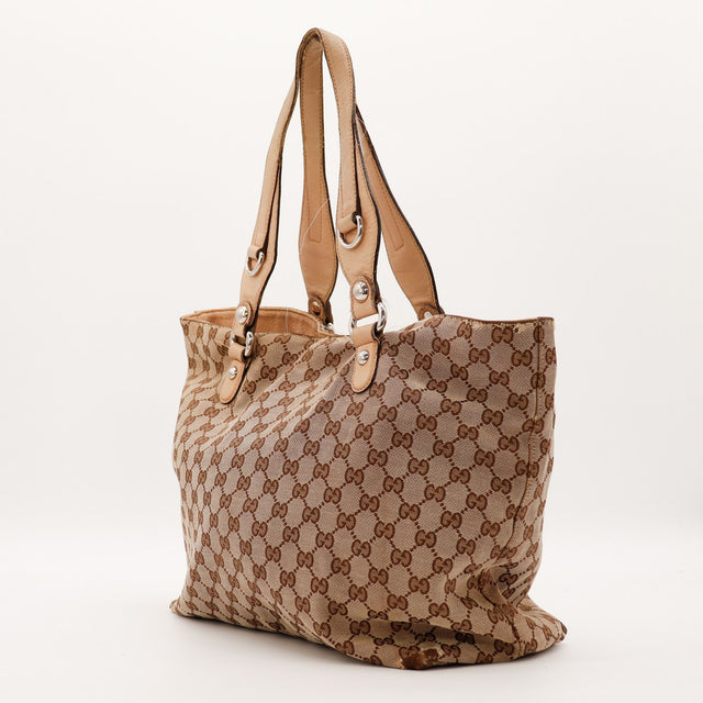Détail anses cuir clair Gucci Tote Bag toile monogrammée occasion authentique — AMANA Vintage